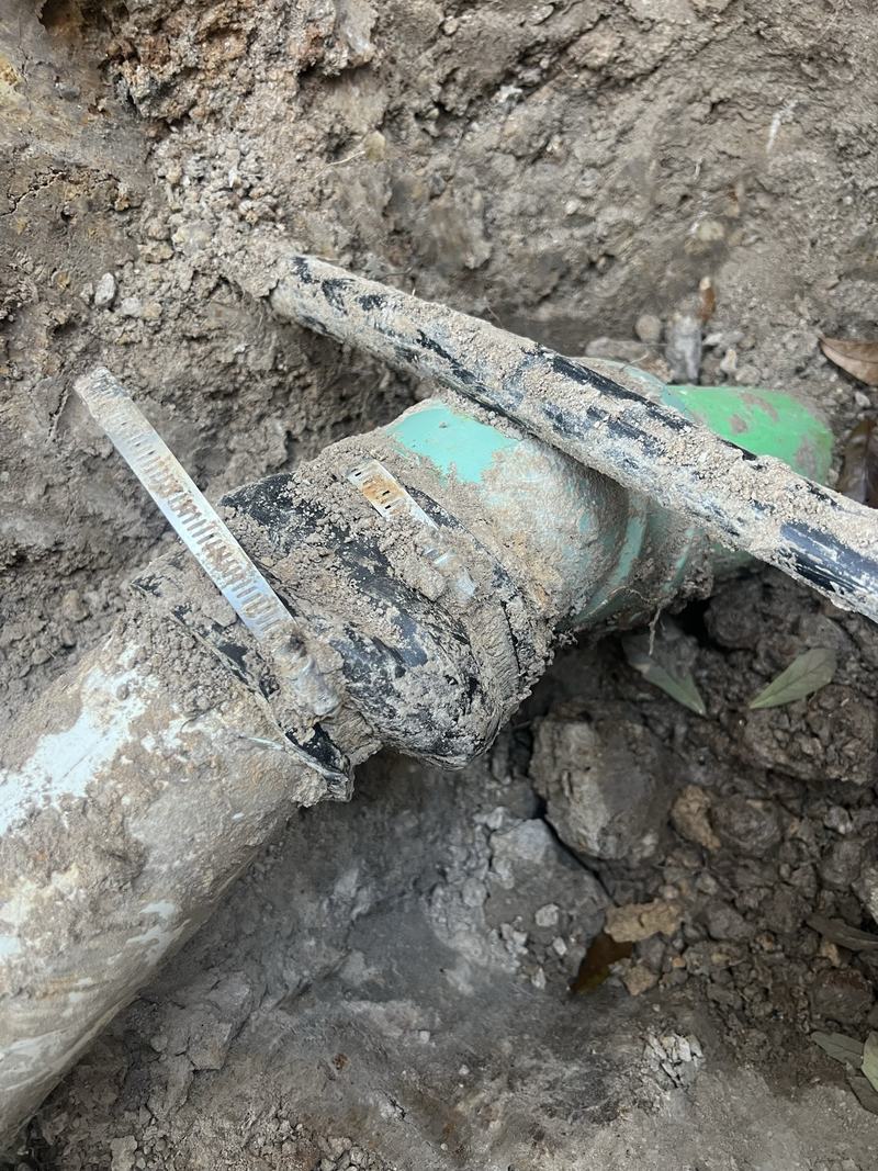 Building sewer connection exposed during work at the city sewer main