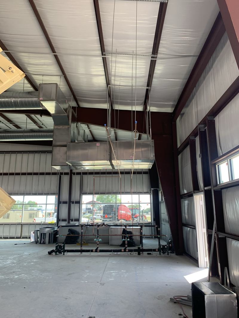 Commercial building interior with plumbing rough-in in progress