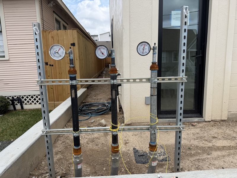 Gas line manifold with pressure test gauges fitted during a permitted installation