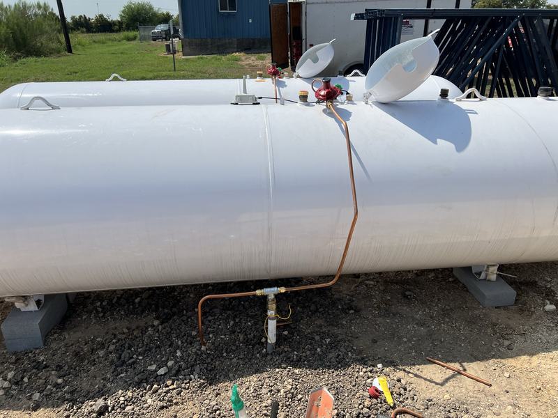 Large gas tank with the supply line connected by a licensed plumber