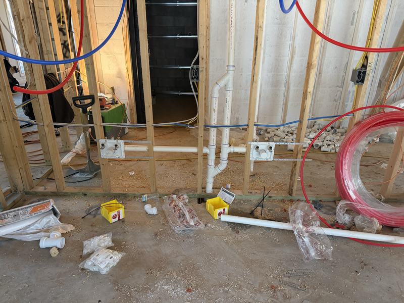 PEX-A water lines and manifold in an open framed wall