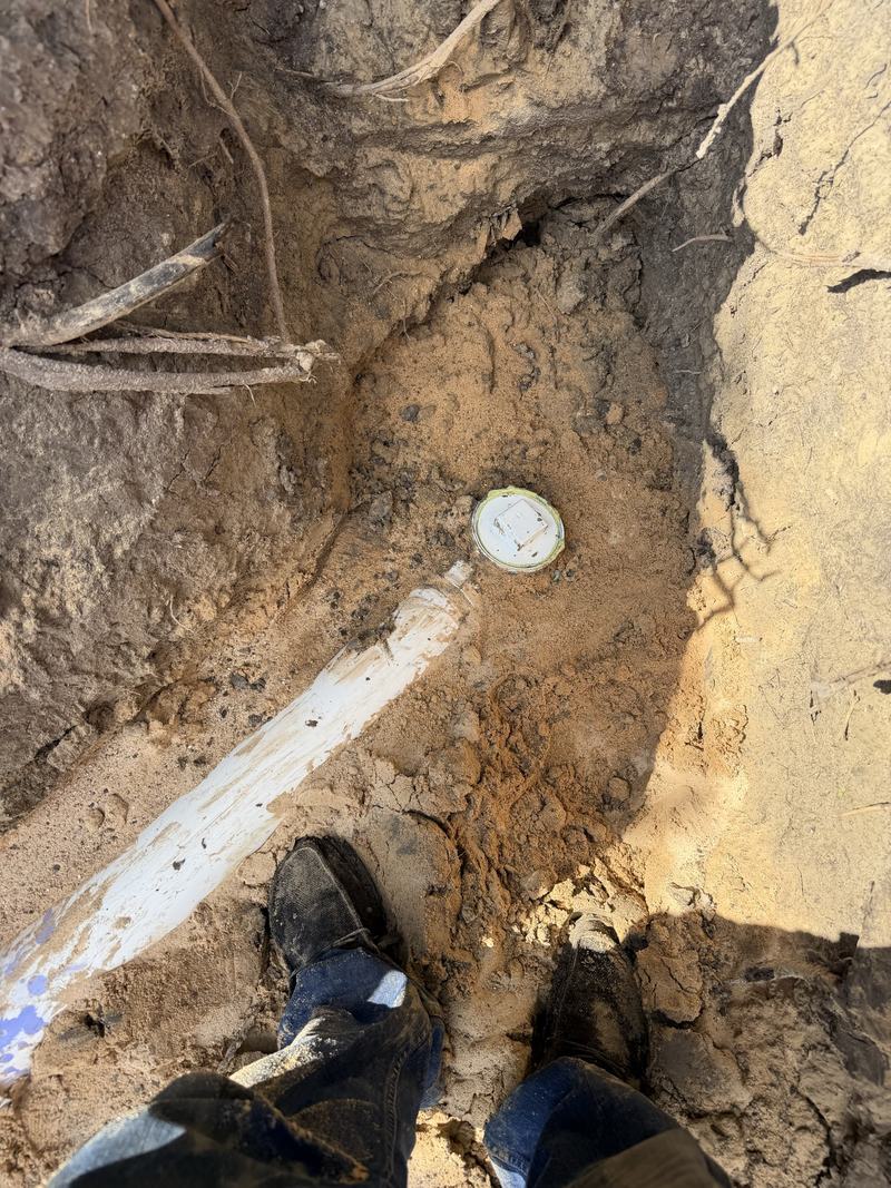 Sewer clean out installed in an excavated trench