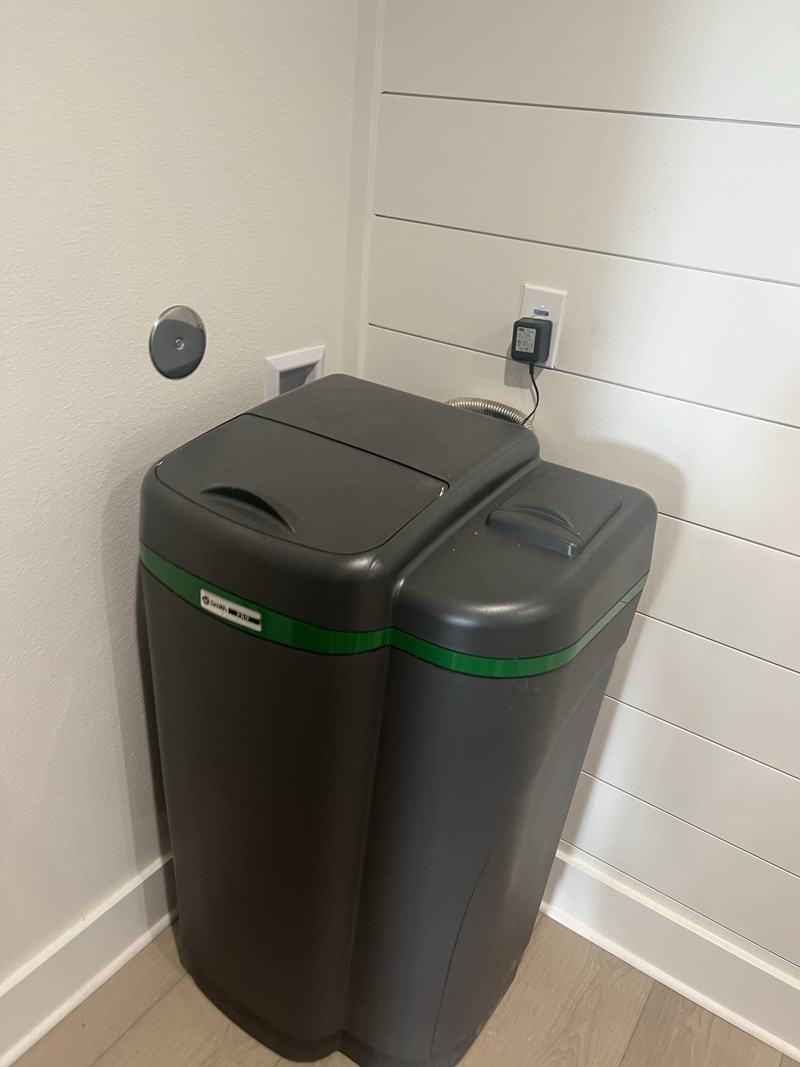 Water treatment tank installed in a utility space