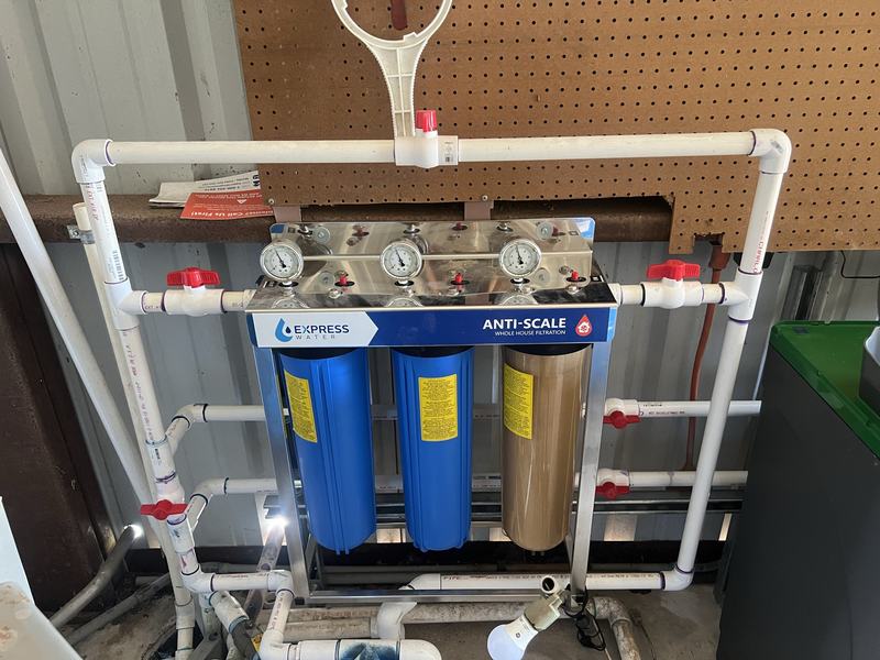 Whole house water filtration system with pressure gauges and bypass valves